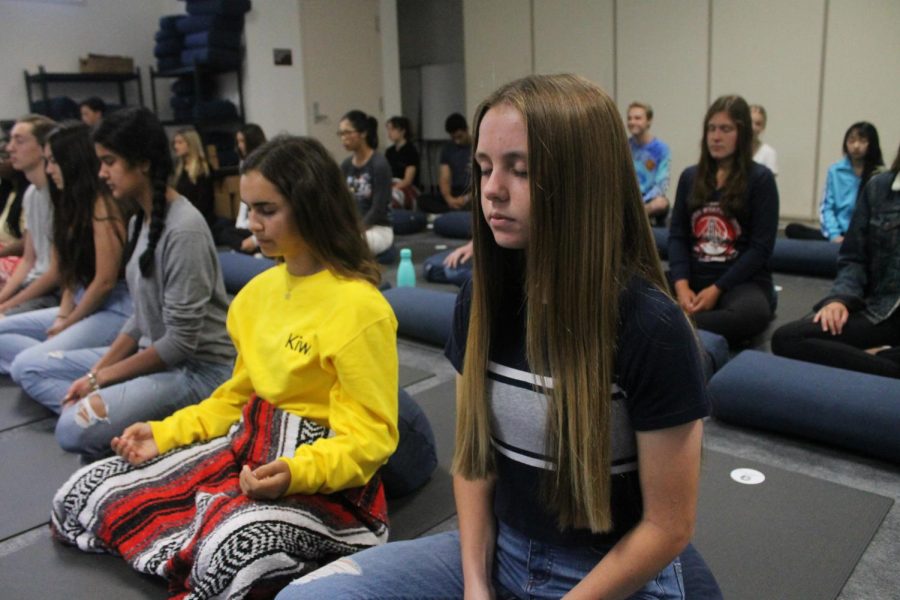 Students practice meditation in Mindfulness class.