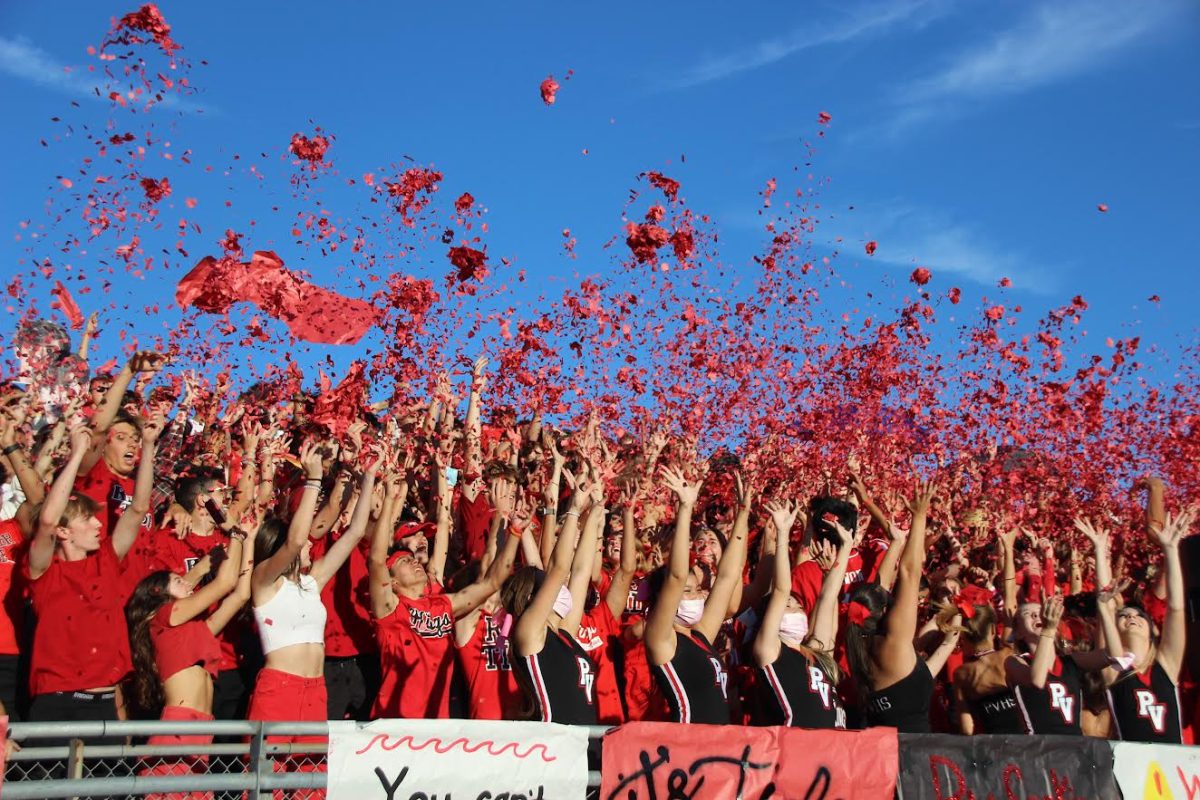 The Red Tide student section celebrated a 34-0 win over the Peninsula Panthers at Peninsula HS on October 29, 2021. The rival games were a much-anticipated event on the hill, until this year. (Photo by Aidan Sun, PVHS Point 2021/22)